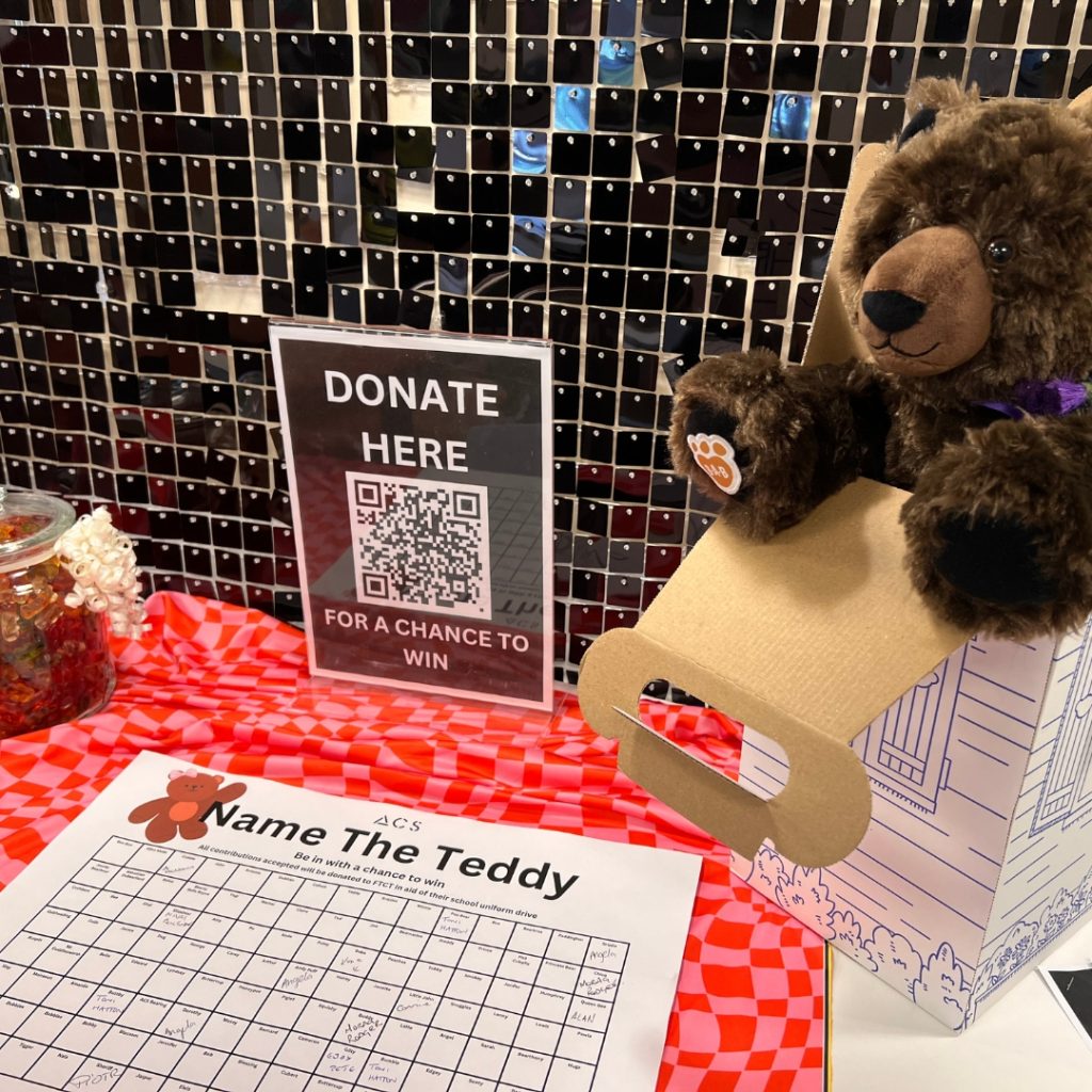 Our ACS Stall with Guess the Name of the Teddy and the Guess how many sweets are in the jar games.