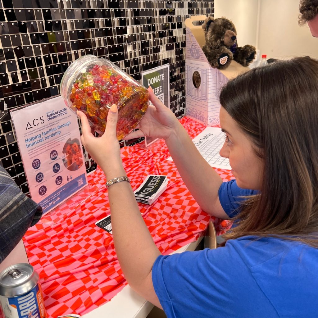 ACS Team Member Angela inspecting the jar of sweets
